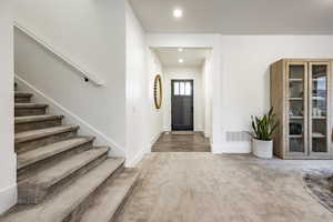 Foyer entrance featuring hardwood / wood-style flooring