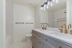 Bathroom featuring toilet and vanity