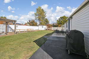 View of yard featuring a patio area and a shed