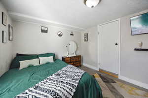 Bedroom featuring a textured ceiling