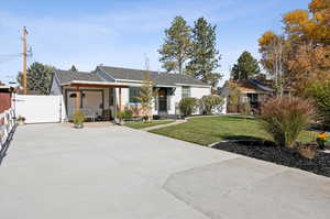 Ranch-style house with a front lawn