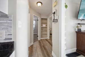 Corridor with wood-style floors