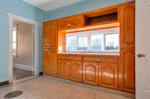 Kitchen with light tile patterned floors