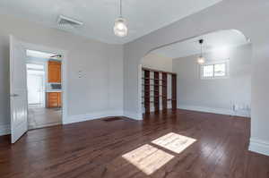 Spare room featuring dark hardwood / wood-style floors