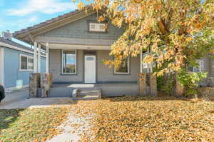 Property entrance with covered porch