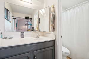 Bathroom featuring toilet and vanity