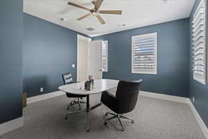 Office featuring carpet floors, a healthy amount of sunlight, and ceiling fan