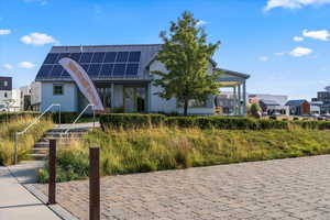 View of front of property with solar panels