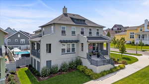 Rear view of property featuring a lawn