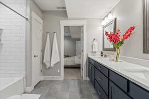 Bathroom with tile patterned flooring and vanity