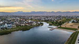 Aerial view at dusk with a water and mountain view