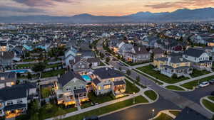 Aerial view at dusk featuring a mountain view