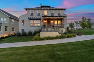 View of front of home featuring a porch and a yard