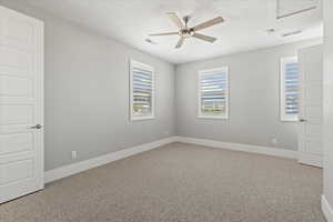 Unfurnished room featuring light carpet and ceiling fan