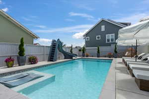 View of pool with a water slide