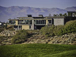 Back of house featuring a mountain view