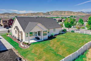 Exterior space with stucco siding, a mountain view, and entry steps