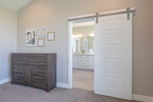 Interior space with light carpet and baseboards