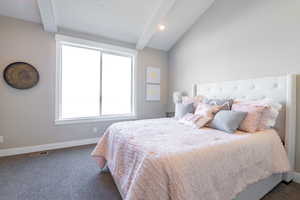 Bedroom with baseboards, carpet floors, vaulted ceiling with beams, and recessed lighting
