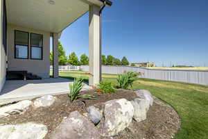 View of yard with a fenced backyard and a patio area