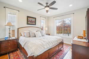 Bedroom featuring wood-type flooring and ceiling fan