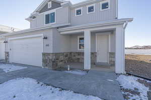 View of property with a garage