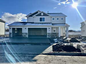 View of front of property featuring a garage