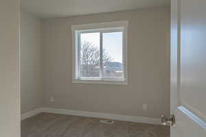 View of carpeted spare room