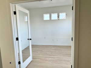 Hall featuring light hardwood / wood-style floors