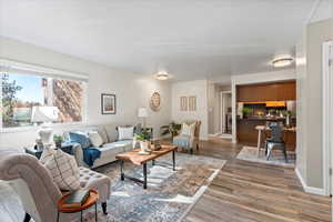 Living room featuring hardwood / wood-style floors and washer / clothes dryer