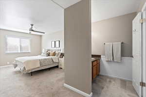 Bedroom featuring ceiling fan and light colored carpet