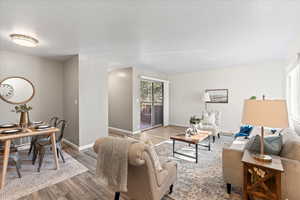 Living room with hardwood / wood-style flooring