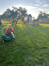 View of yard featuring a playground