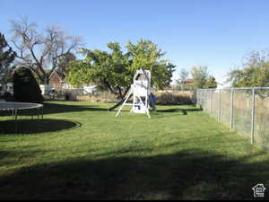 View of yard with a trampoline