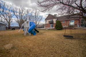 View of playground with a yard