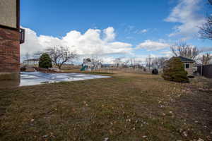 View of yard featuring a playground and a patio