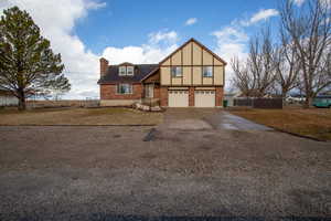 Tudor home featuring a garage