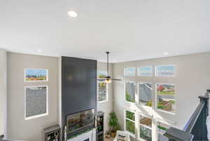 Living room featuring ceiling fan, natural light & spectacular views