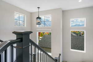 Foyer featuring a chandelier and a wealth of natural light & spectacular views