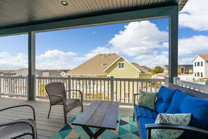 Wooden terrace featuring an outdoor living space, outside of the master suite