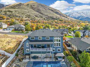 Rear view of house featuring a patio area and a mountain view