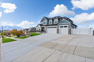 View of front of house with a garage and a mountain view