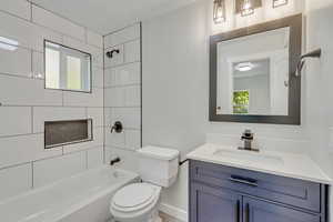 Full view of ensuite attached bathroom to primary suite.