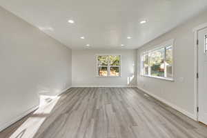 Unfurnished room with light hardwood / wood-style floors