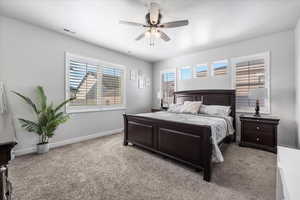 Bedroom featuring light colored carpet and ceiling fan