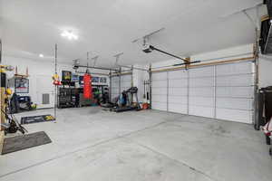 Garage featuring a garage door opener