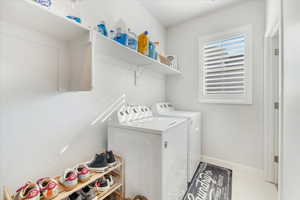 Laundry room featuring washing machine and clothes dryer