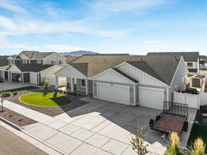 View of front of house with a garage and a mountain view