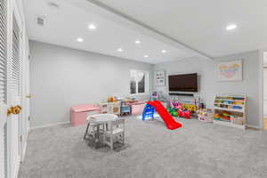 Playroom featuring light carpet