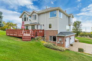 Side view of the house with beautiful flower bed in Spring and Summer